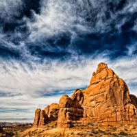Scale - A formation in Arches National Park basks in the morning sun. Image by Jon Armstrong. | Blurbomat.com