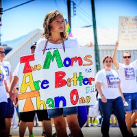 Two Moms Are Better Than One - Girl holding a sign in the PFLAG entry of the Salt Lake City LGBT Pride March.| Blurbomat.com
