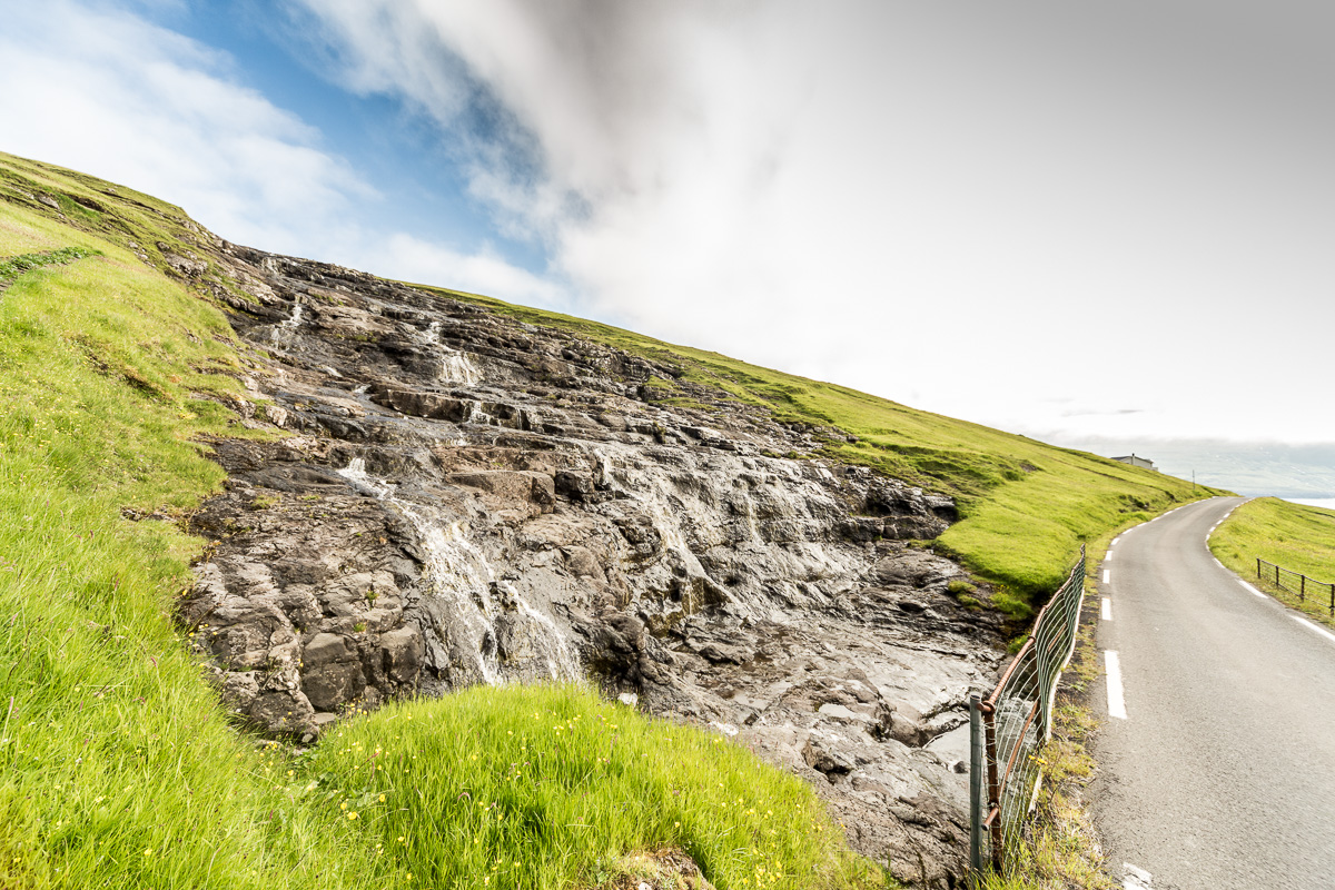 Waterfall along the road to Kvívík, Faroe Islands - Blurbomat.com