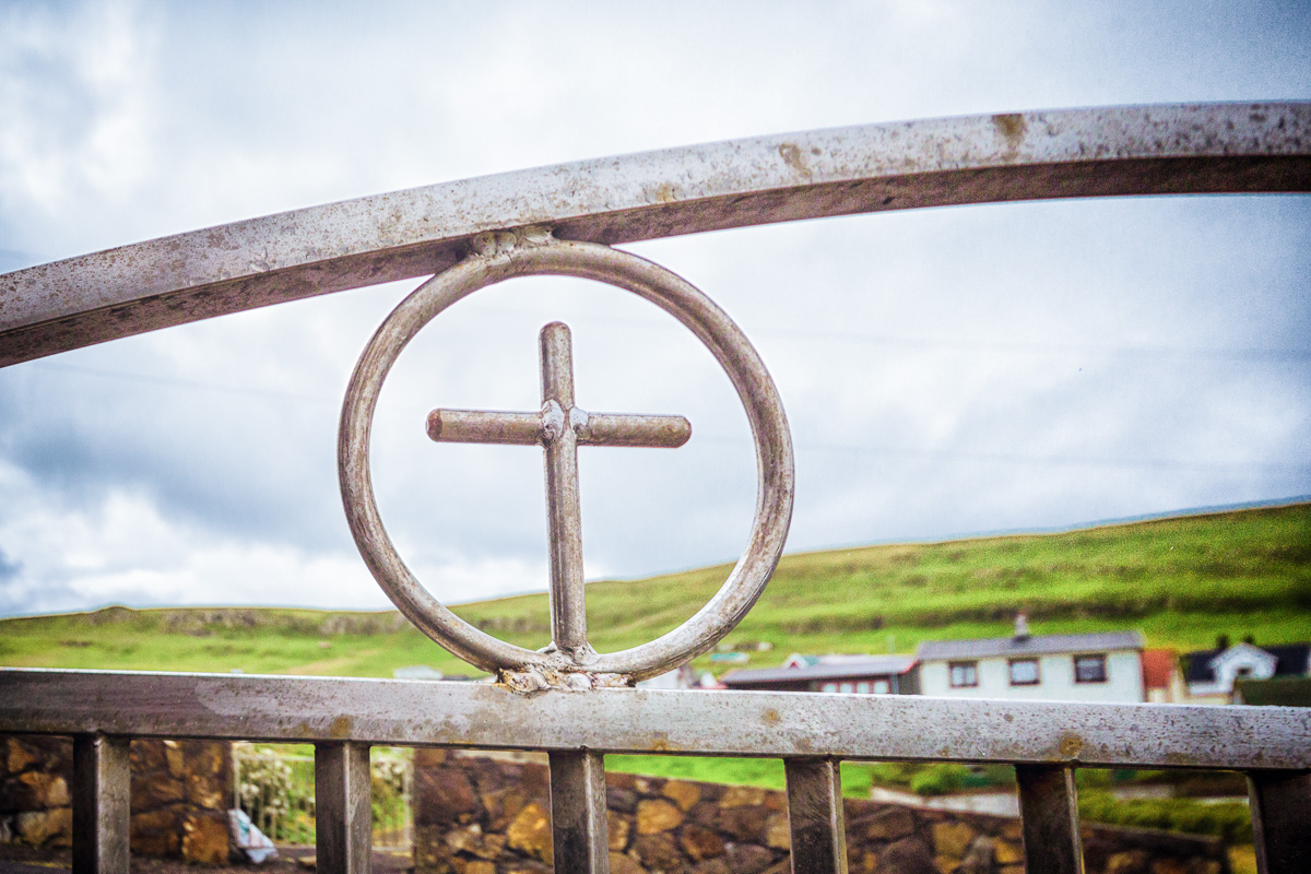 Steel cross in the church gate at Vágur, Suduroy, Faroe Islands.